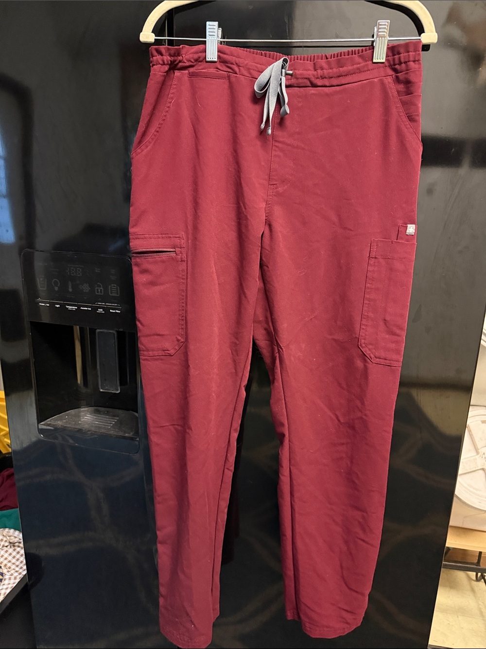 FIGS Women’s Technical Collection Pants in Maroon with Grey tie